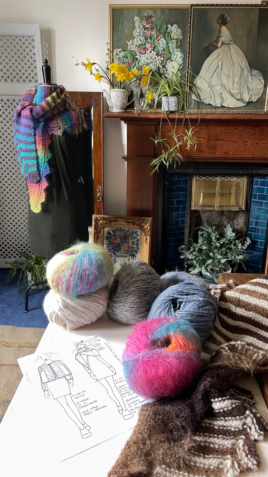 Yarn, garments, and design materials in Louisa Harding\'s studio