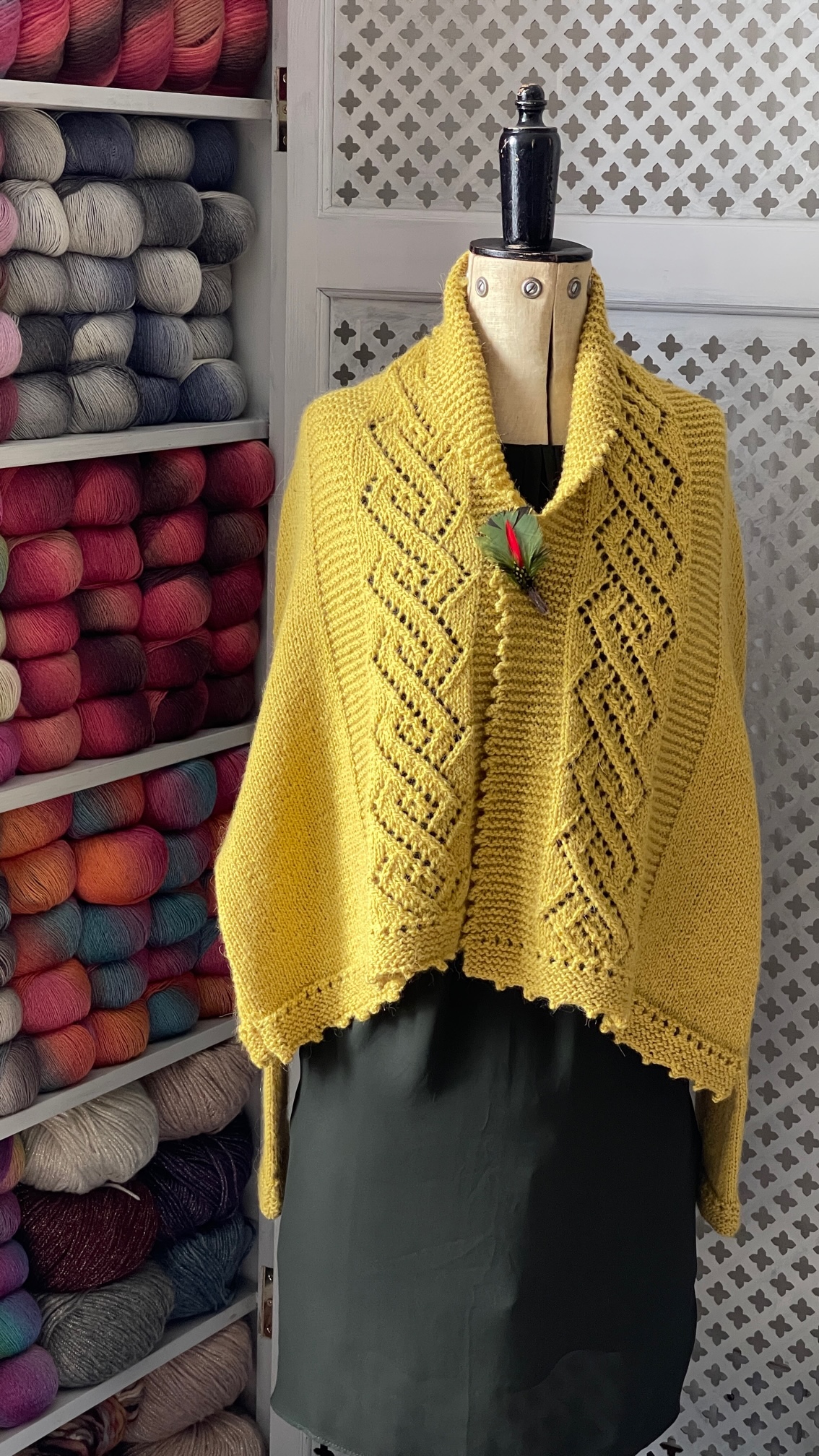 Yarn, garments, and design materials in Louisa Harding\'s studio